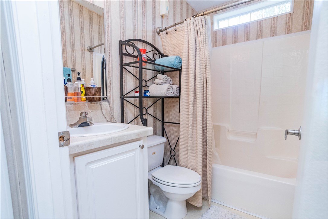 301 Valencia Street Sebastian, FL 32958 - Photo 20 of 29 a bathroom with a sink a toilet and shower