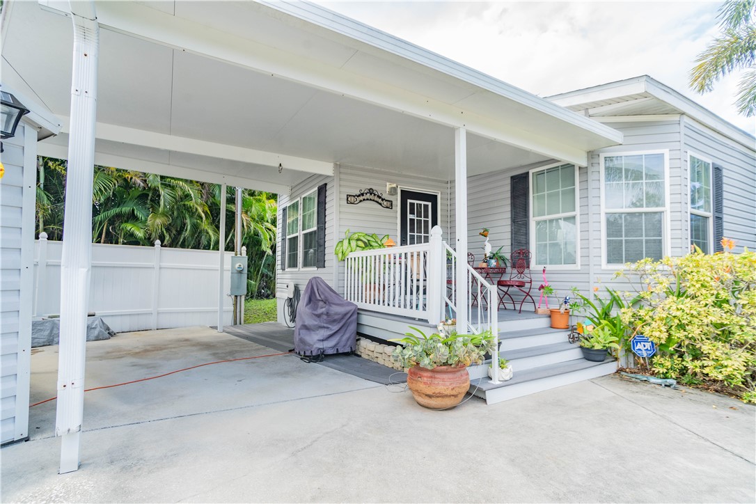 301 Valencia Street Sebastian, FL 32958 - Photo 23 of 29 front view of a house with a garden