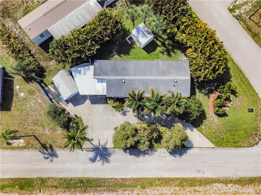 301 Valencia Street Sebastian, FL 32958 - Photo 5 of 29 an aerial view of a house with a yard