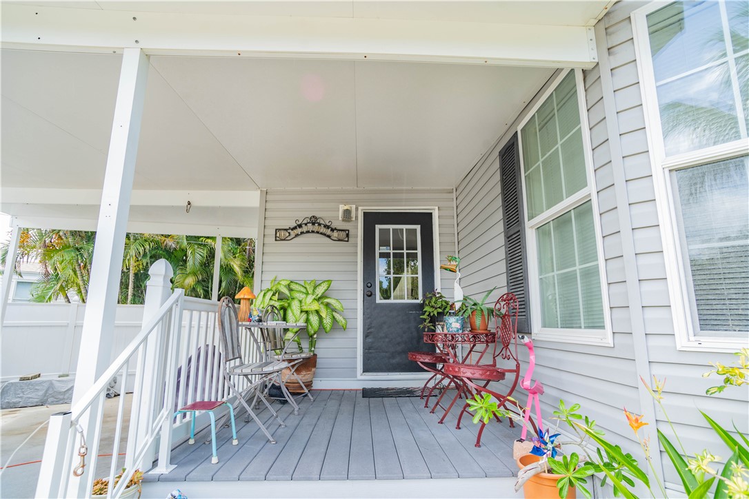 301 Valencia Street Sebastian, FL 32958 - Photo 8 of 29 a living room filled with furniture and a table