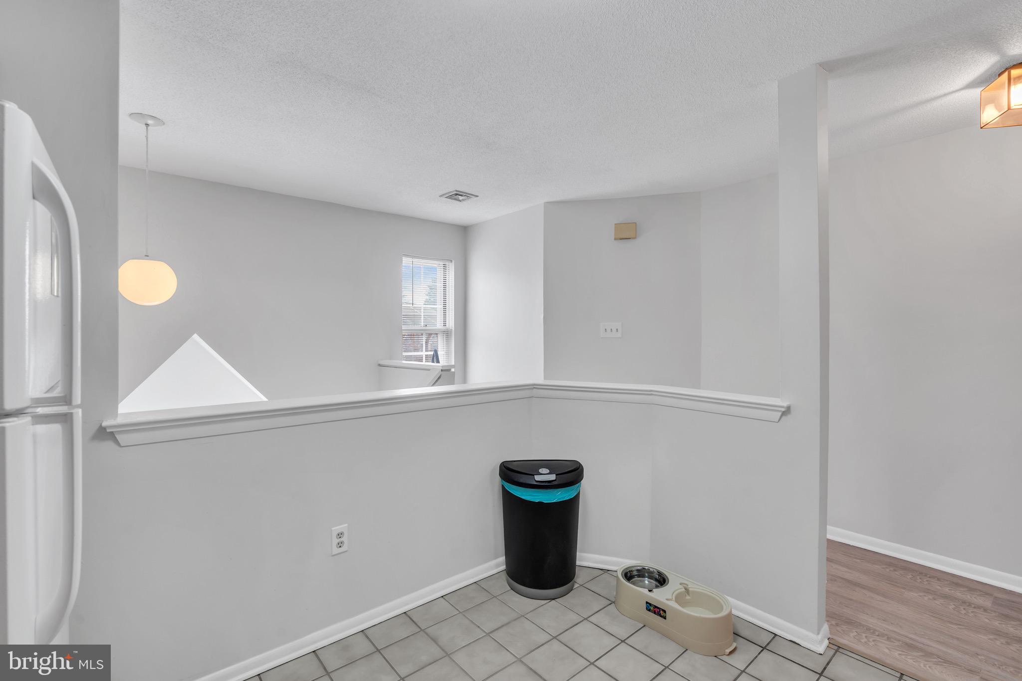 70 Pinewood Drive Hamilton, NJ 08690 - Photo 15 of 40 a view of water heater room with wooden floor