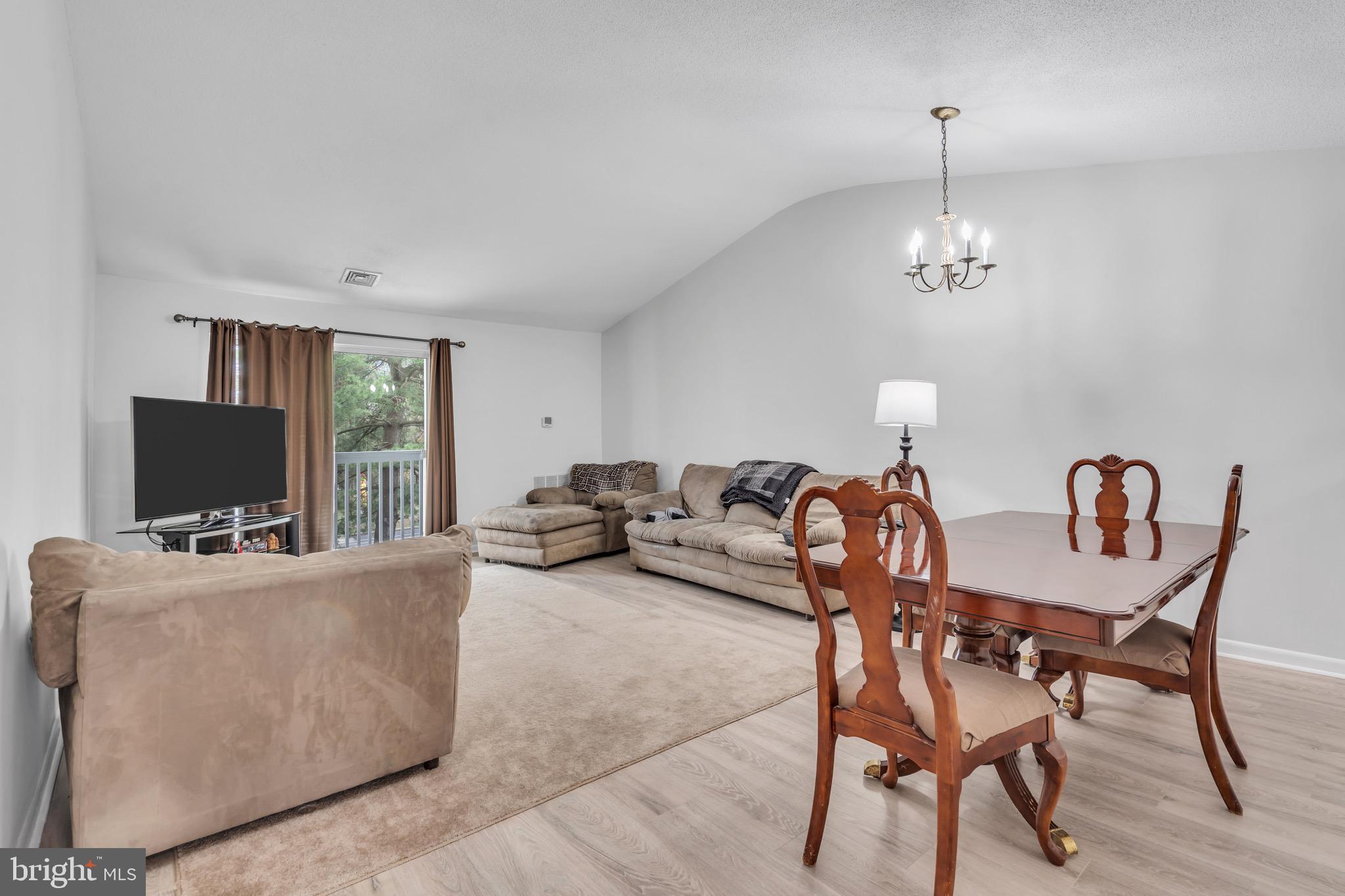 70 Pinewood Drive Hamilton, NJ 08690 - Photo 16 of 40 a living room with furniture and a flat screen tv
