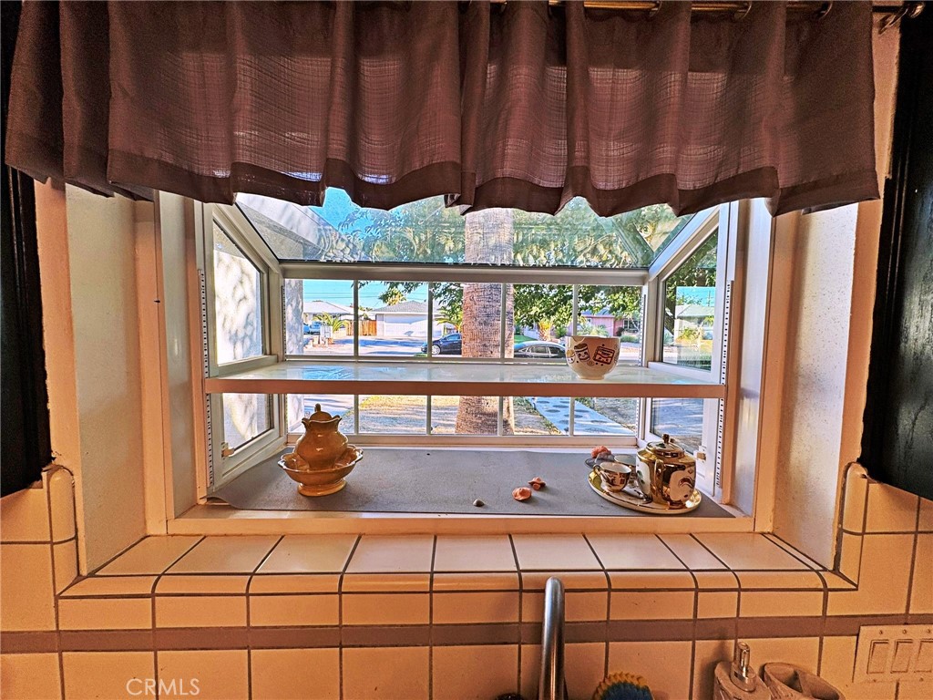 428 West Perdew Avenue Ridgecrest, CA 93555 - Photo 5 of 18 a table with wine bottles and glasses on it