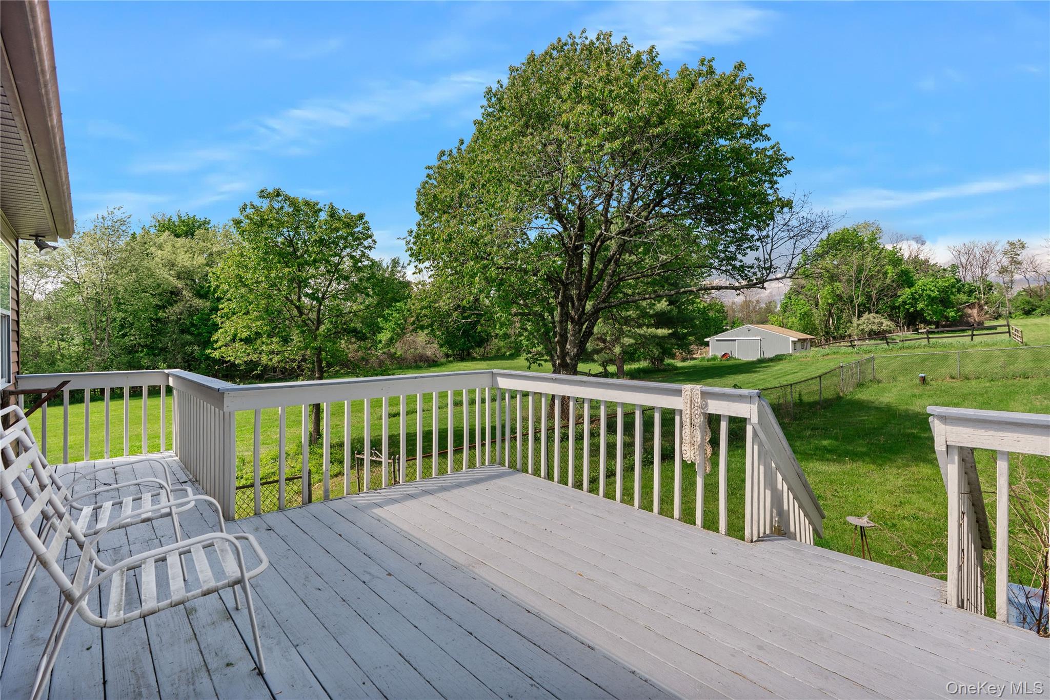 200 Conklingtown Road Goshen, NY 10924 - Photo 20 of 43 a balcony with wooden floor table and chairs