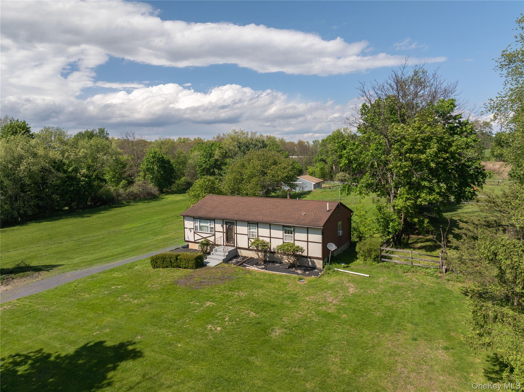 200 Conklingtown Road Goshen, NY 10924 - Photo 2 of 43 an aerial view of a house with swimming pool garden and mountains