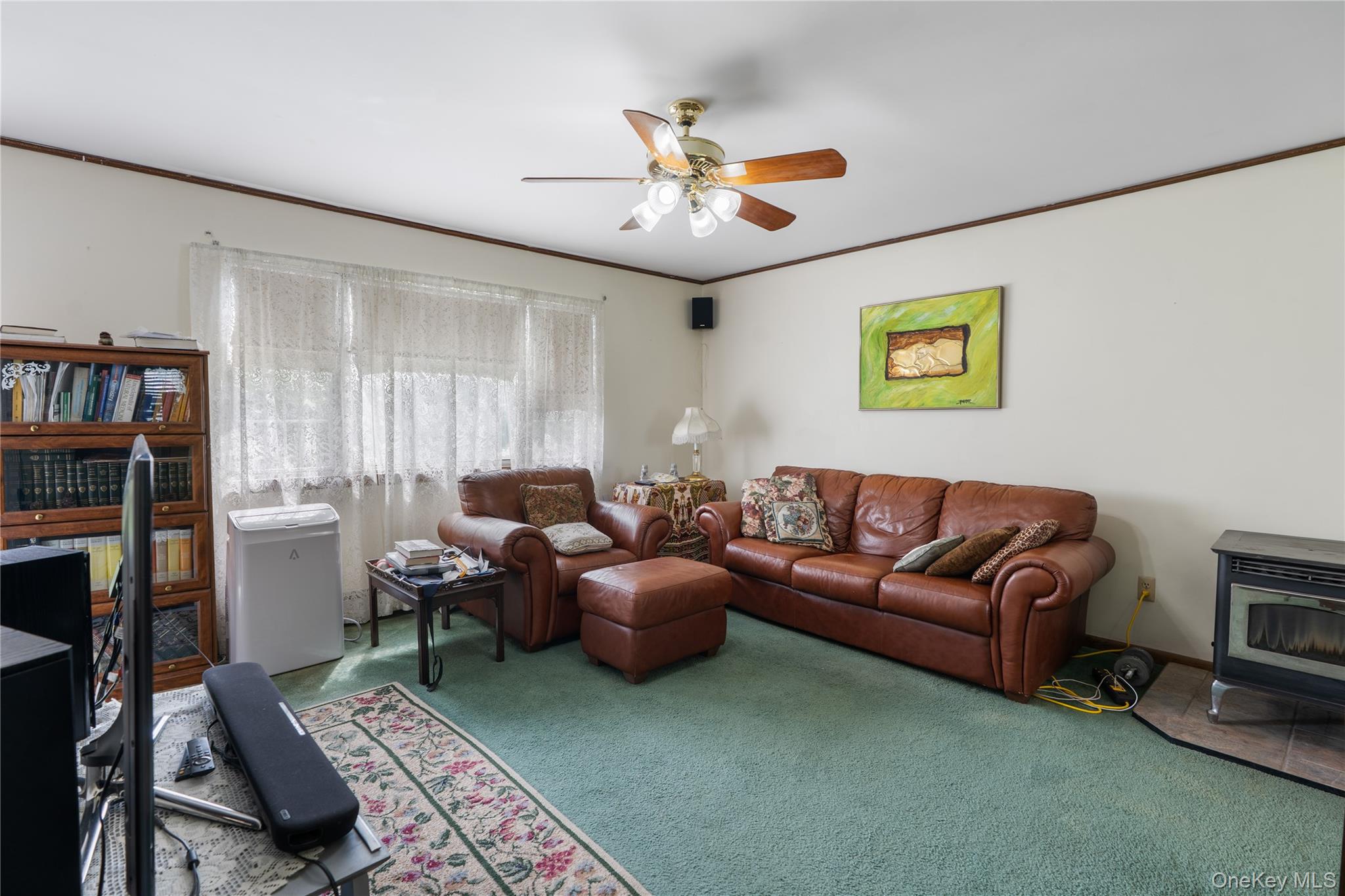 200 Conklingtown Road Goshen, NY 10924 - Photo 23 of 43 a living room with furniture and a book shelf