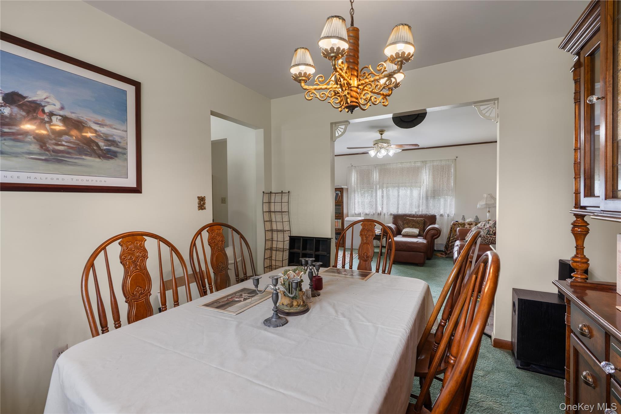 200 Conklingtown Road Goshen, NY 10924 - Photo 26 of 43 a dining room with furniture a chandelier and wooden floor
