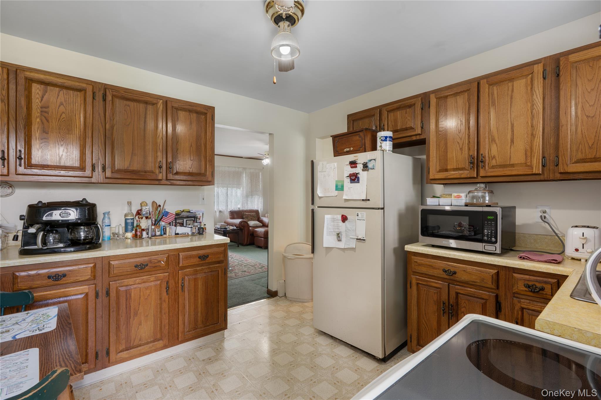 200 Conklingtown Road Goshen, NY 10924 - Photo 29 of 43 a kitchen with stainless steel appliances granite countertop a stove top oven a refrigerator a sink and dishwasher with wooden cabinets