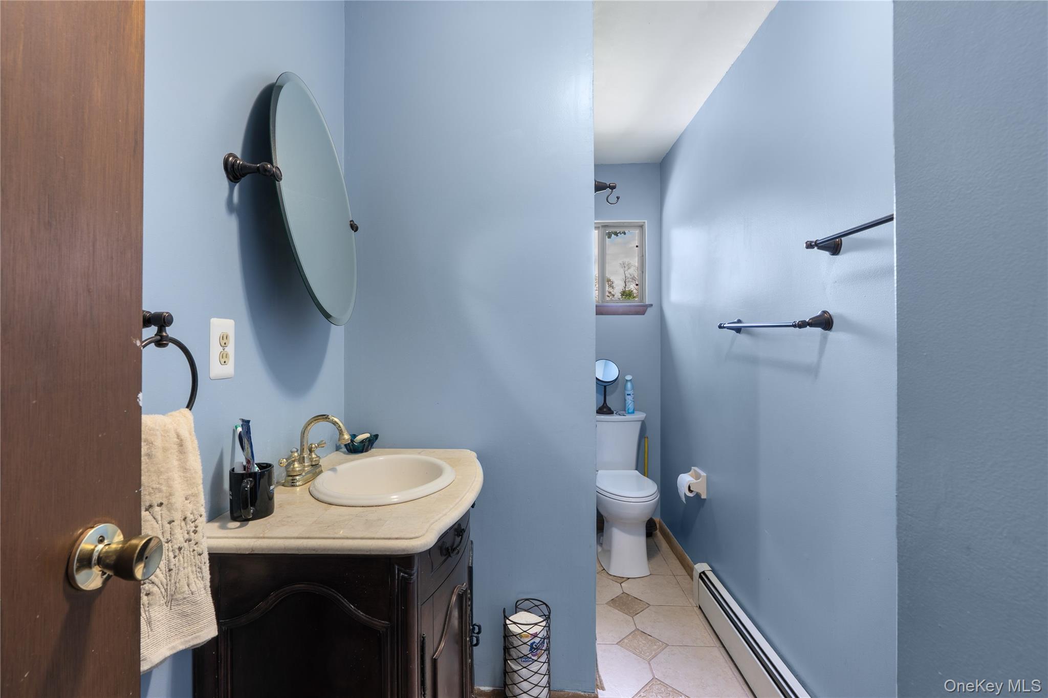200 Conklingtown Road Goshen, NY 10924 - Photo 33 of 43 a bathroom with a sink a toilet and a mirror