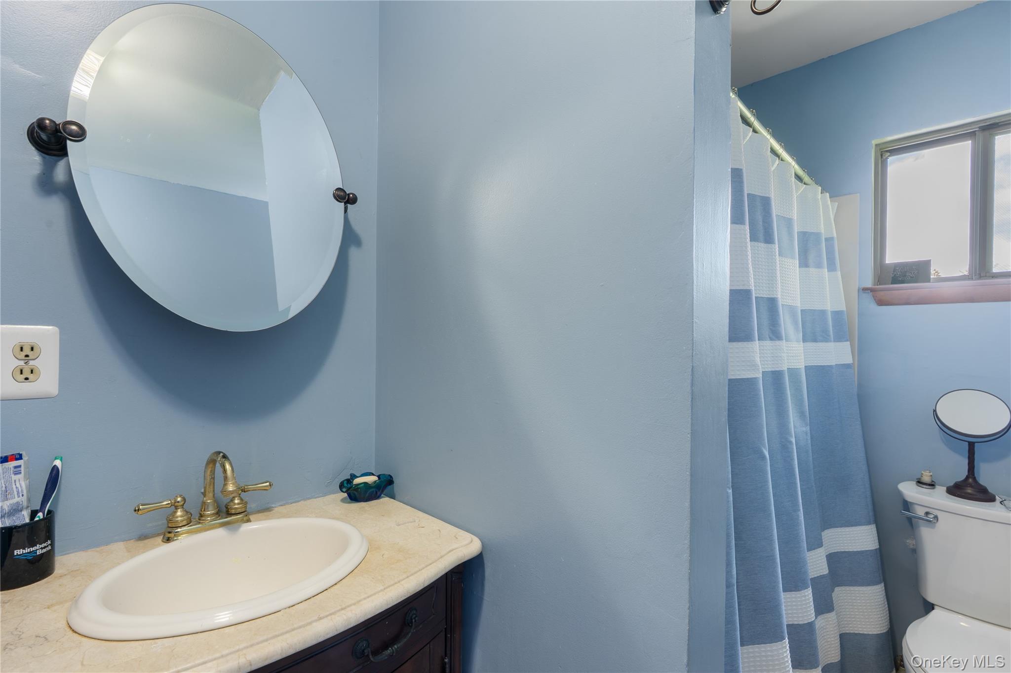 200 Conklingtown Road Goshen, NY 10924 - Photo 34 of 43 a bathroom with a sink mirror and toilet