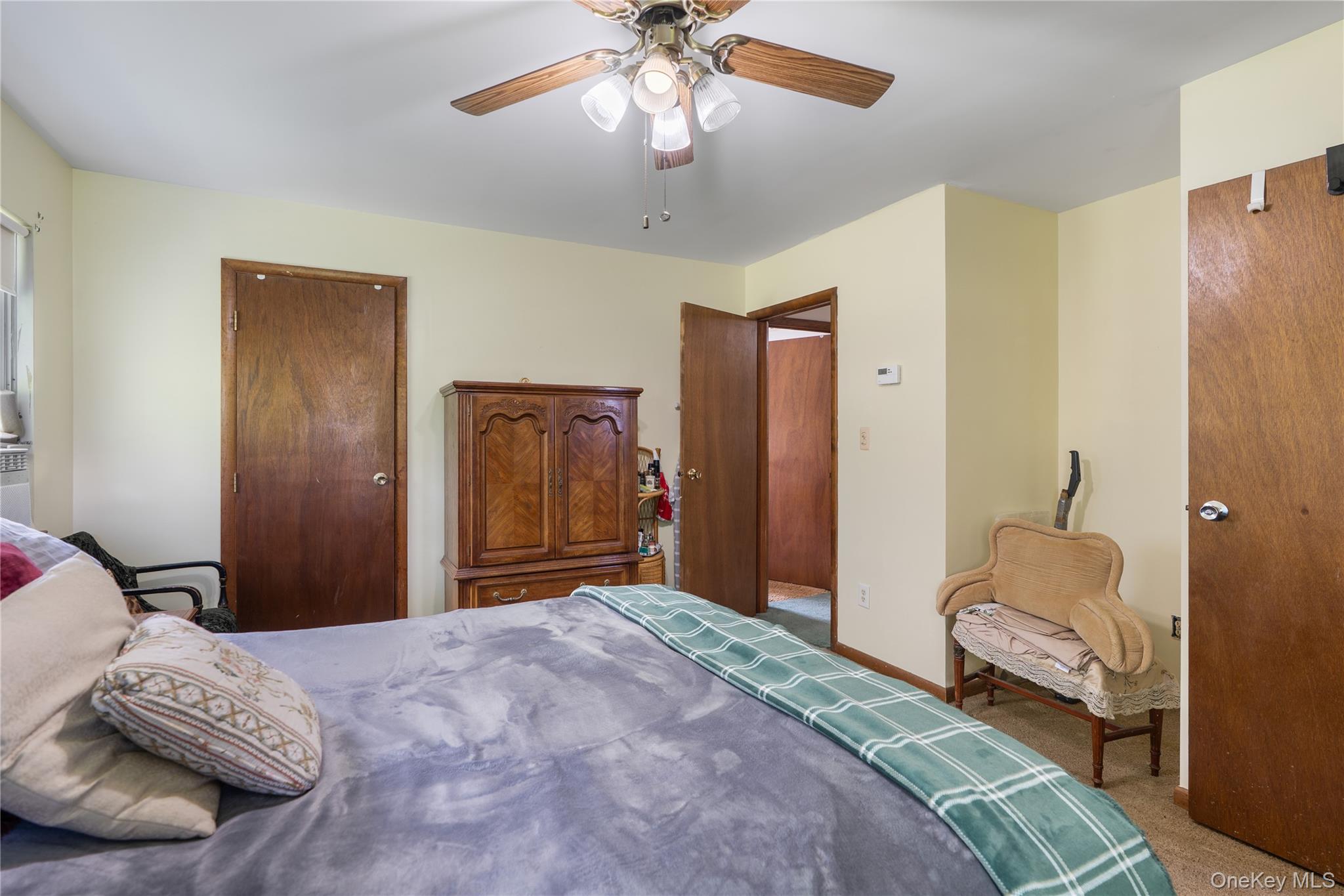 200 Conklingtown Road Goshen, NY 10924 - Photo 39 of 43 a bedroom with a bed and a chandelier