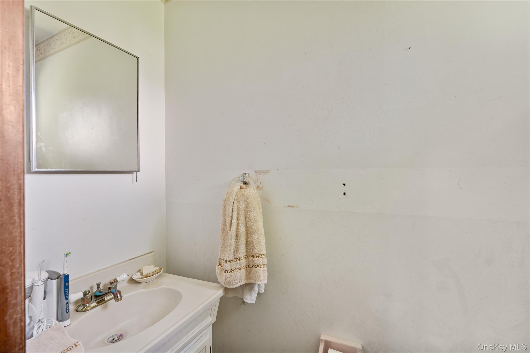 200 Conklingtown Road Goshen, NY 10924 - Photo 40 of 43 a bathroom with a sink and a mirror