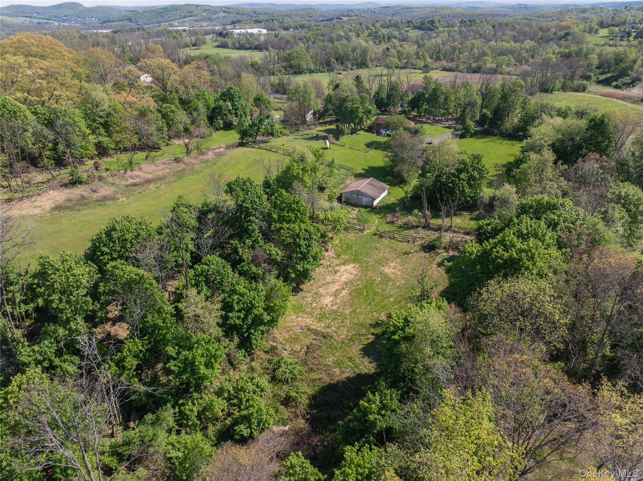 200 Conklingtown Road Goshen, NY 10924 - Photo 8 of 43 an aerial view of residential houses with outdoor space and trees