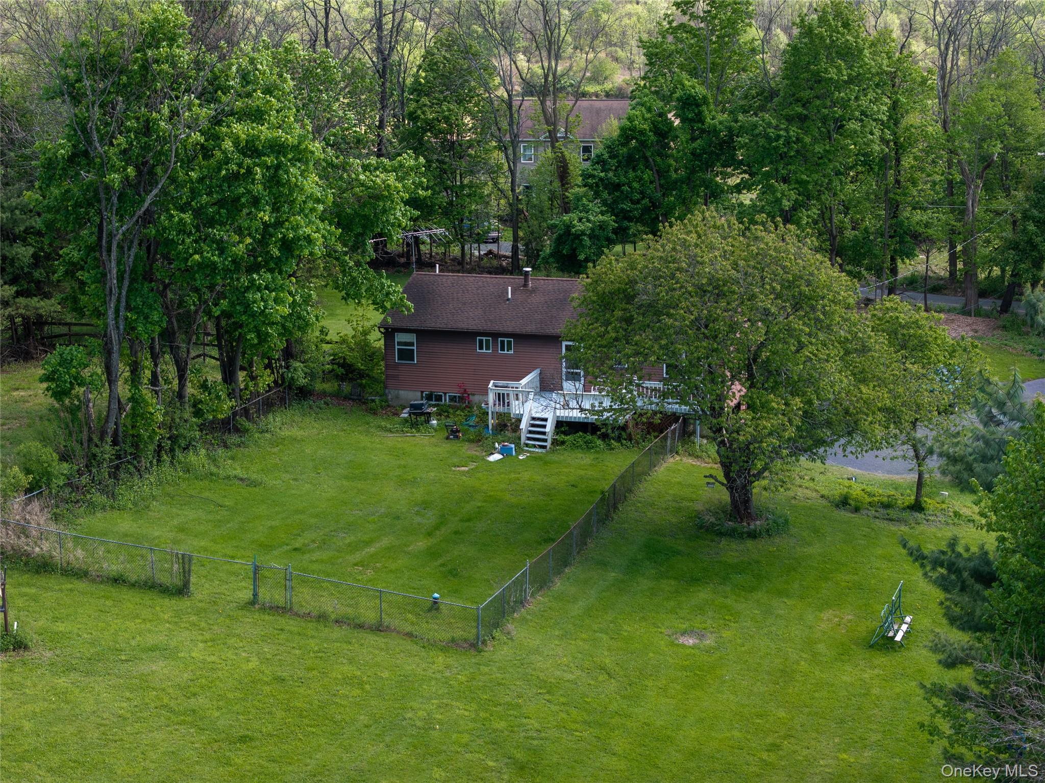 200 Conklingtown Road Goshen, NY 10924 - Photo 10 of 43 a view of a house with a yard table and chairs