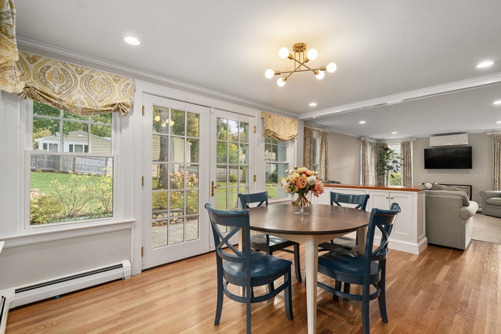 43 Bertwell Road Lexington, MA 02420 - Photo 11 of 37 a view of a dining room with furniture window and wooden floor