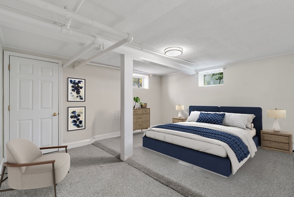 43 Bertwell Road Lexington, MA 02420 - Photo 30 of 37 a bedroom with a bed and a chair