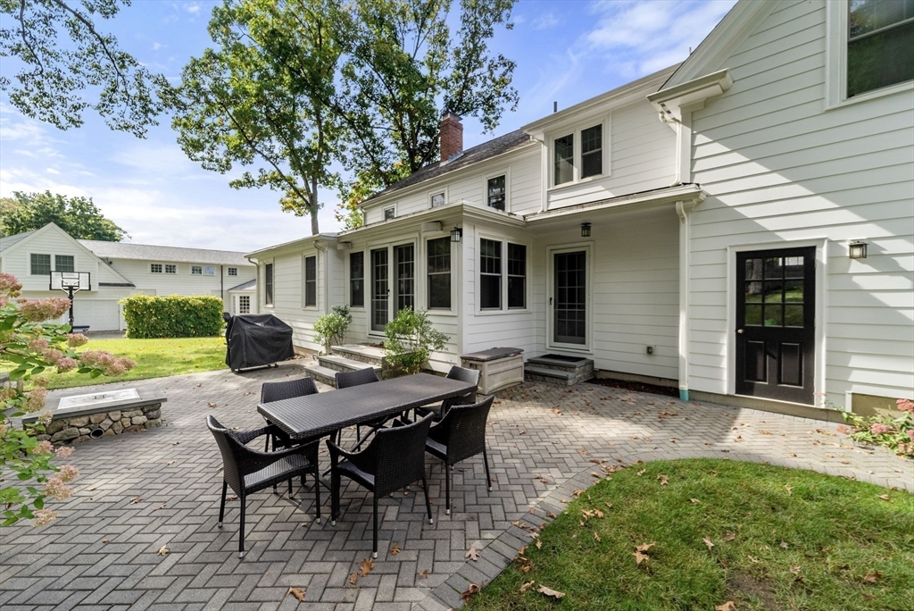 43 Bertwell Road Lexington, MA 02420 - Photo 33 of 37 a view of a house with backyard sitting area and porch