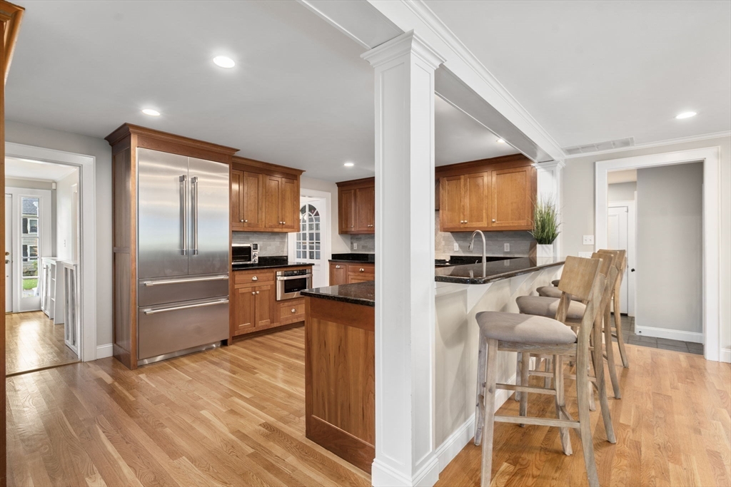 43 Bertwell Road Lexington, MA 02420 - Photo 9 of 37 a living room with furniture and a flat screen tv