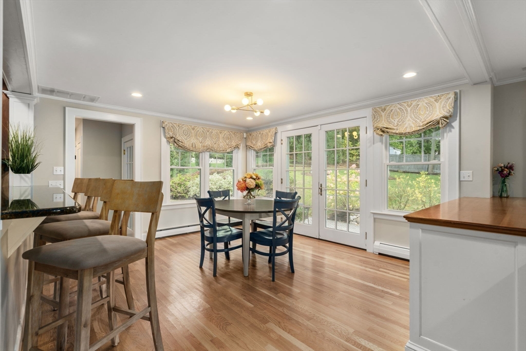 43 Bertwell Road Lexington, MA 02420 - Photo 10 of 37 a dining room with furniture and wooden floor