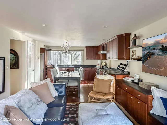a view of a balcony with chair and wooden fence