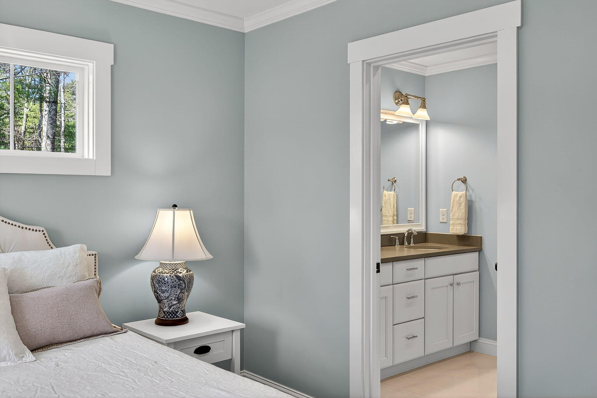 176 Bumps River Road Osterville, MA 02655 - Photo 19 of 54 a room with a lamp and a dresser
