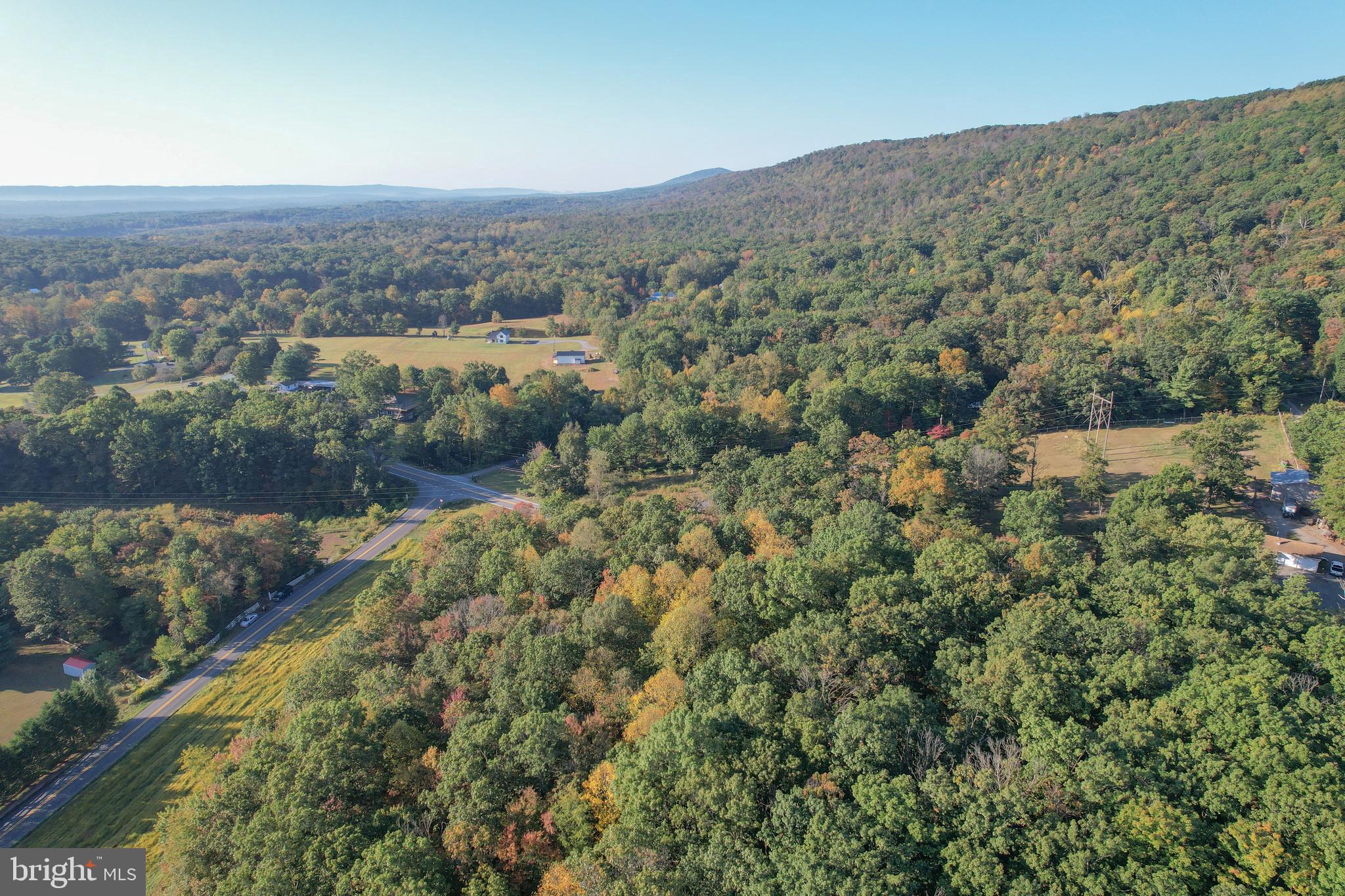 an aerial view of mountain with trees