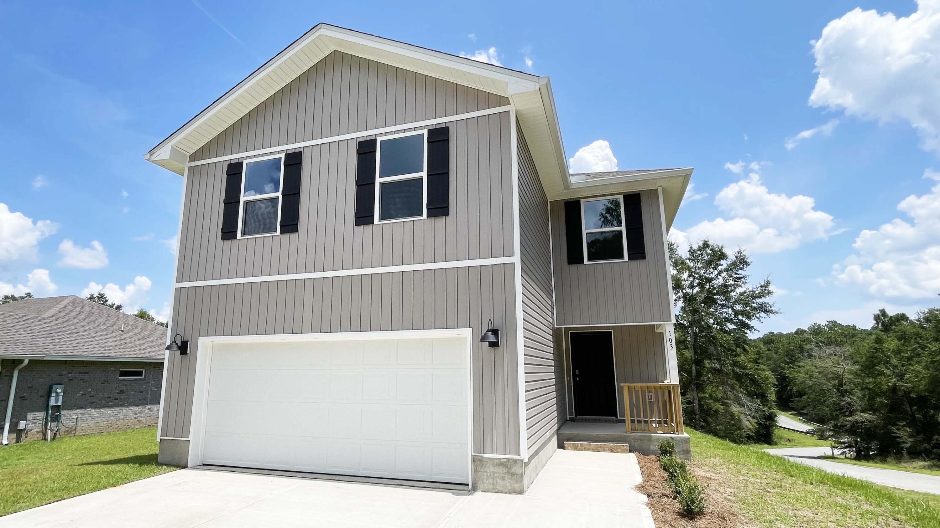 103 Brendas Way Crestview, FL 32536 - Photo 2 of 7 a front view of a house with a yard