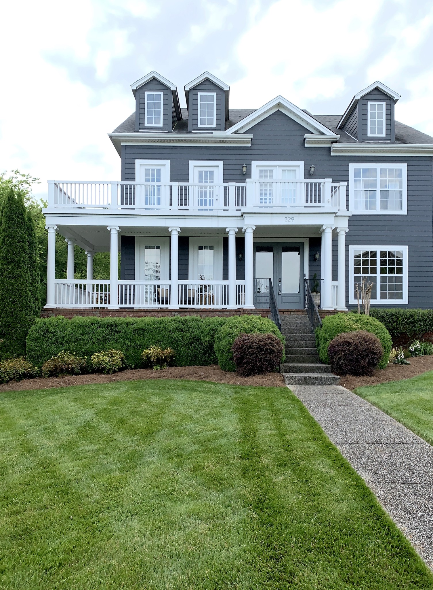a front view of a house with a yard
