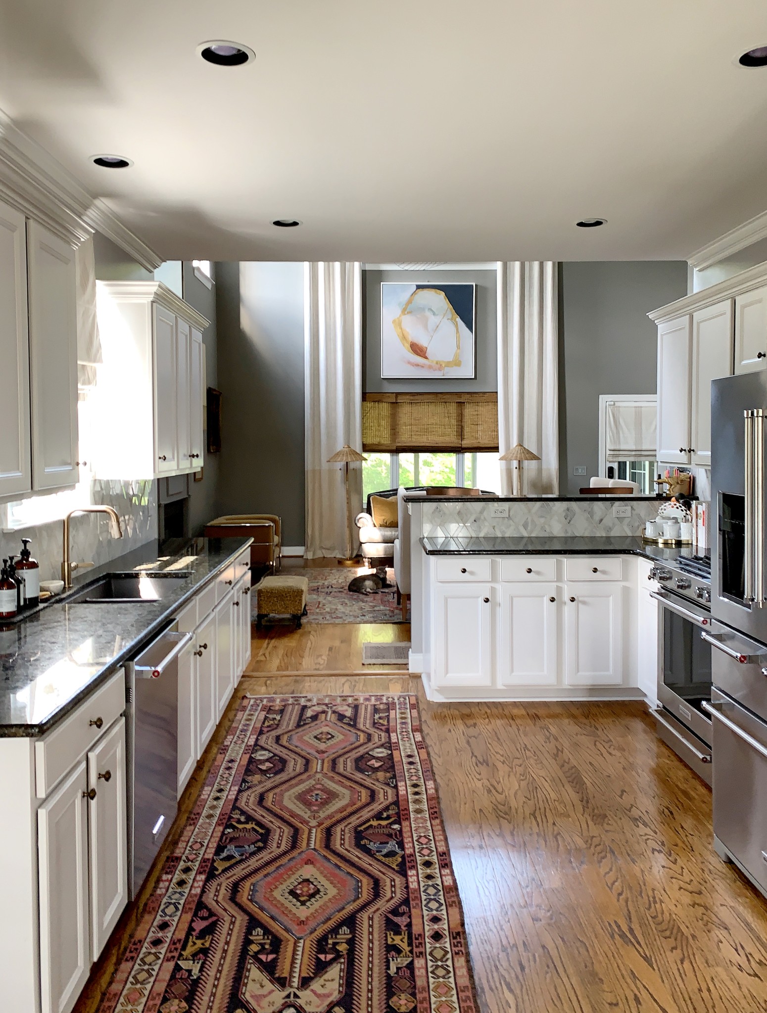 329 Wandering Circle Franklin, TN 37067 - Photo 5 of 23 a large kitchen with stainless steel appliances granite countertop a stove a sink dishwasher and cabinets with wooden floor
