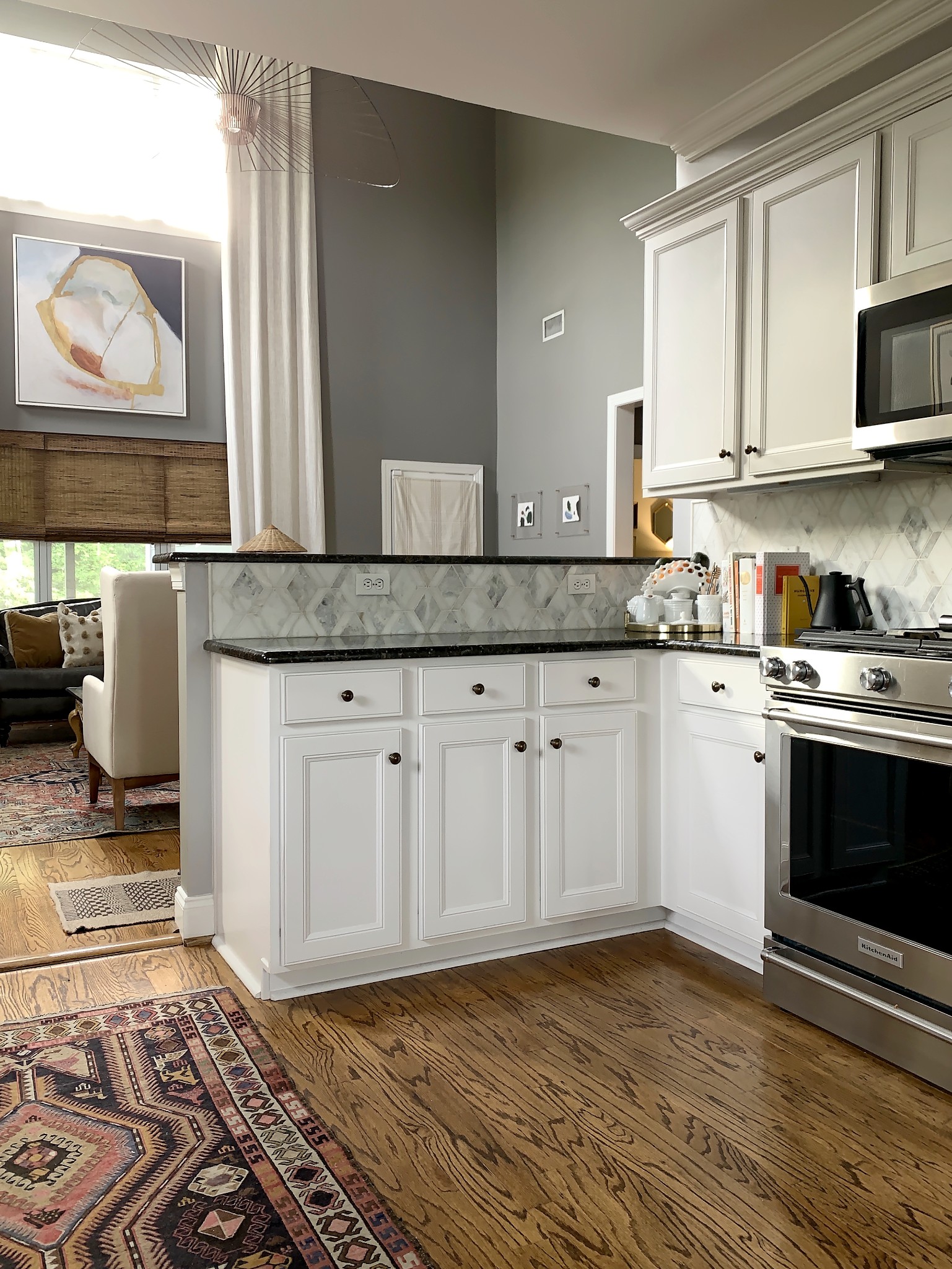 329 Wandering Circle Franklin, TN 37067 - Photo 8 of 23 a kitchen with granite countertop a stove a sink and a microwave