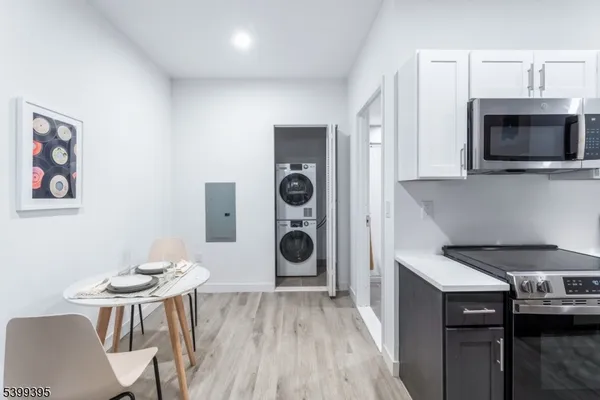 a kitchen with a table and chairs
