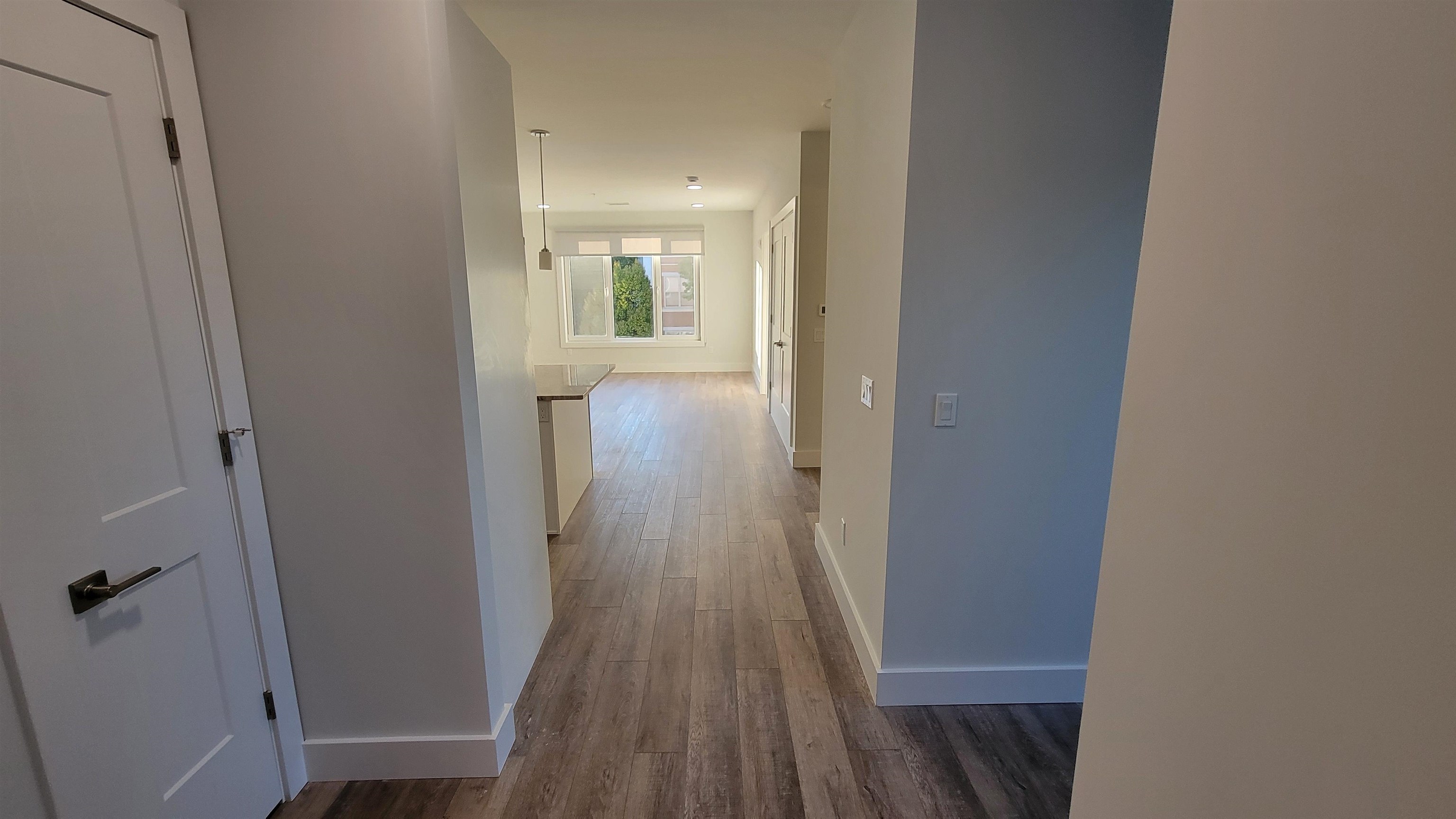 228 Park Avenue, Unit 305 East Rutherford, NJ 07073 - Photo 3 of 11 a view of a room with wooden floor and staircase