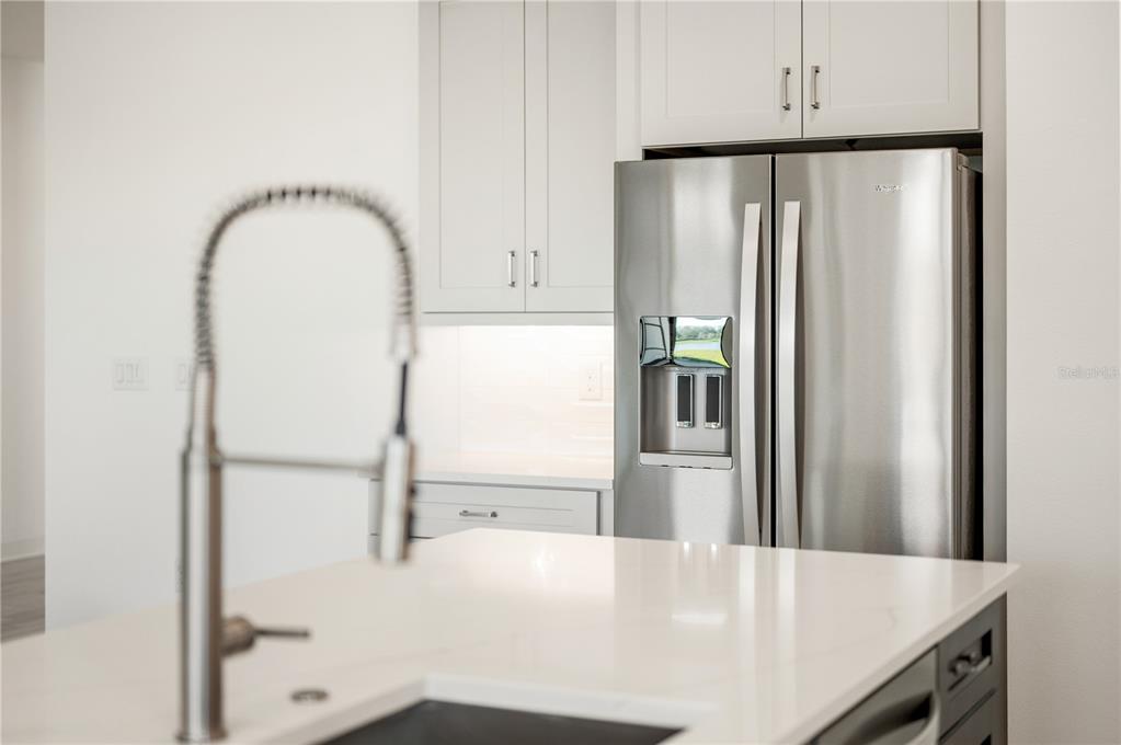 5830 Freestone Circle Apollo Beach, FL 33572 - Photo 11 of 34 a view of a kitchen with a sink and refrigerator