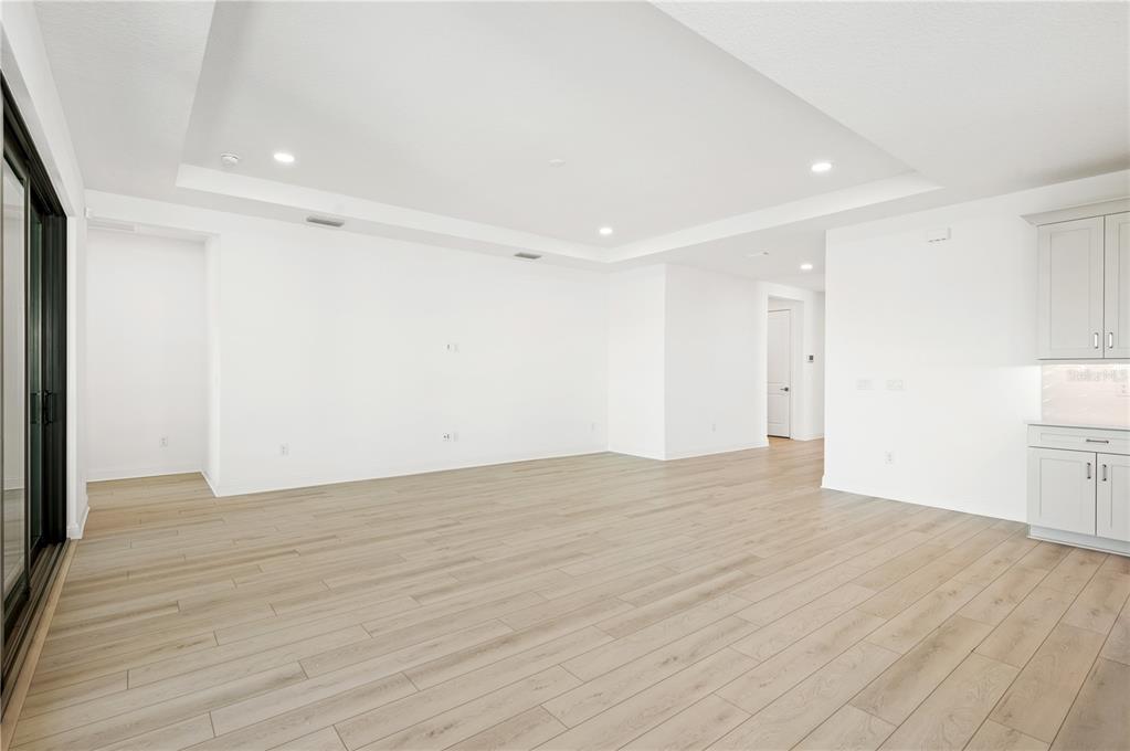 5830 Freestone Circle Apollo Beach, FL 33572 - Photo 15 of 34 a view of empty room with wooden floor