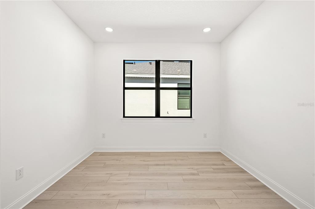 5830 Freestone Circle Apollo Beach, FL 33572 - Photo 25 of 34 a view of empty room with wooden floor and fan
