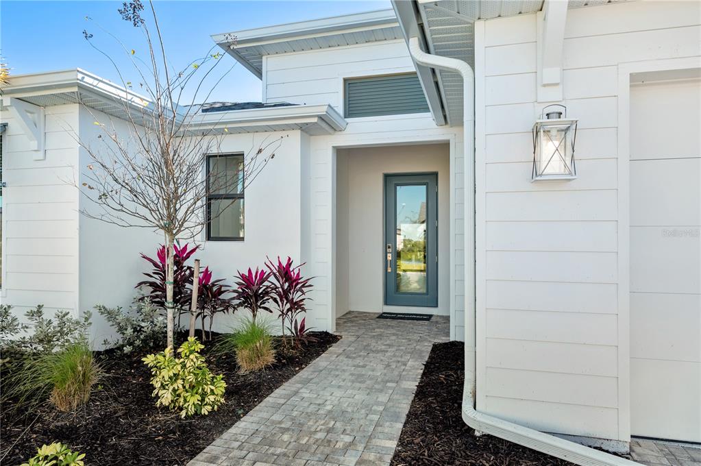 5830 Freestone Circle Apollo Beach, FL 33572 - Photo 3 of 34 a view of a house with a flower garden
