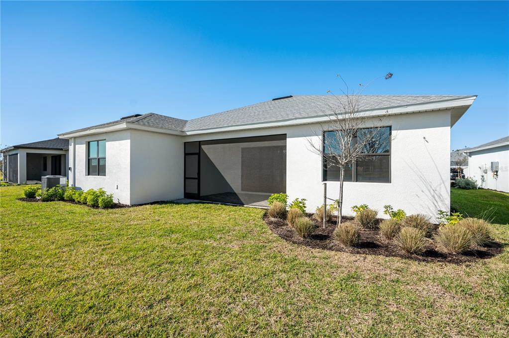 5830 Freestone Circle Apollo Beach, FL 33572 - Photo 34 of 34 a backyard of a house with table and chairs