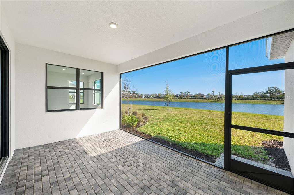 5830 Freestone Circle Apollo Beach, FL 33572 - Photo 4 of 34 a bedroom with a bed and large window