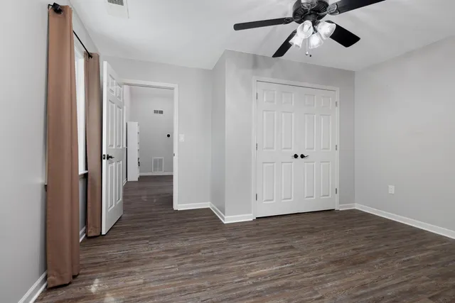 a view of empty room and wooden floor