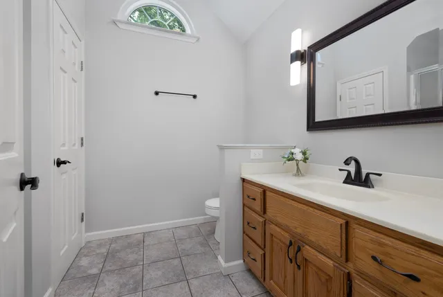 a bathroom with a sink a vanity and a mirror