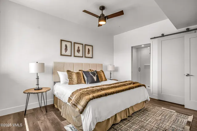 a bedroom with a bed and a lamp