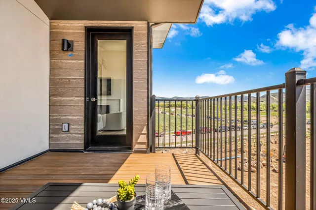 a view of a balcony with wooden floor