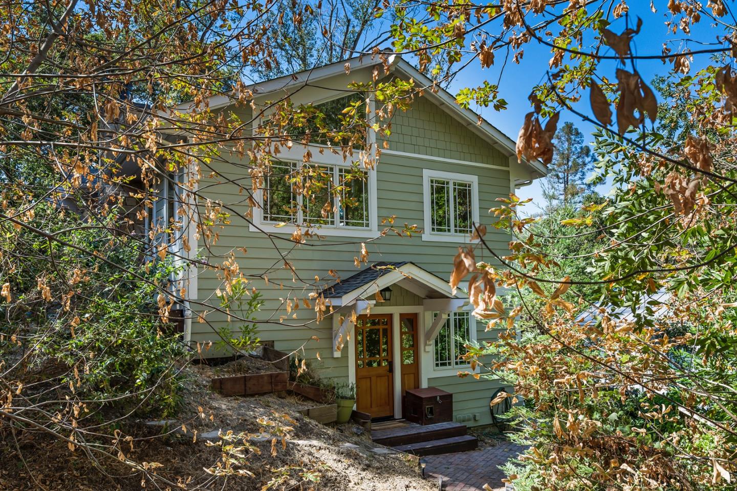 1975 Cordilleras Road Redwood City, CA 94062 - Photo 1 of 39 a front view of a house with a garden
