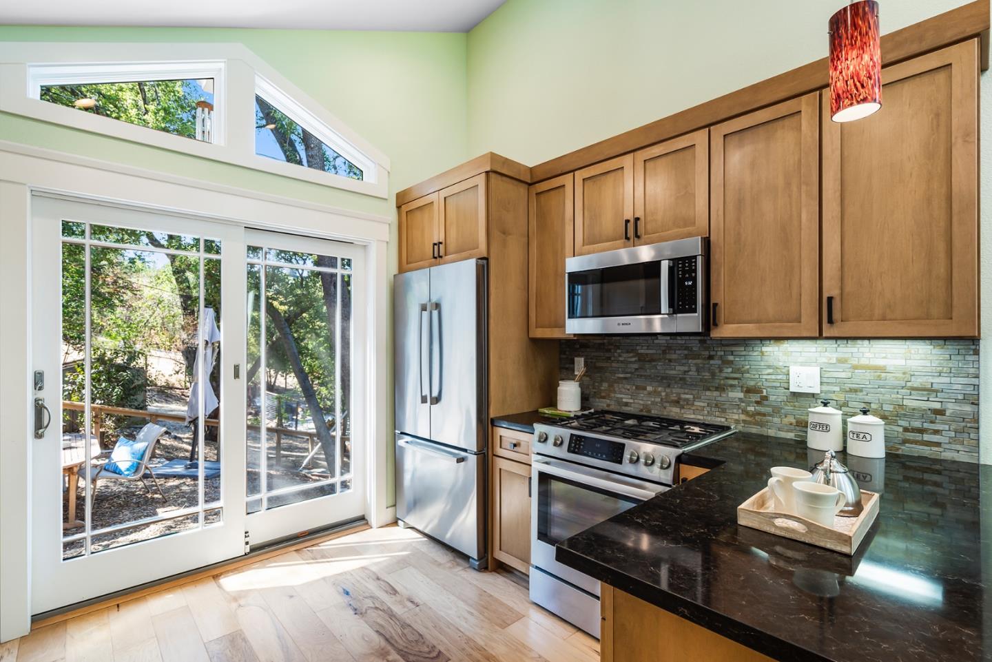 1975 Cordilleras Road Redwood City, CA 94062 - Photo 11 of 39 a kitchen with stainless steel appliances granite countertop a refrigerator stove and microwave