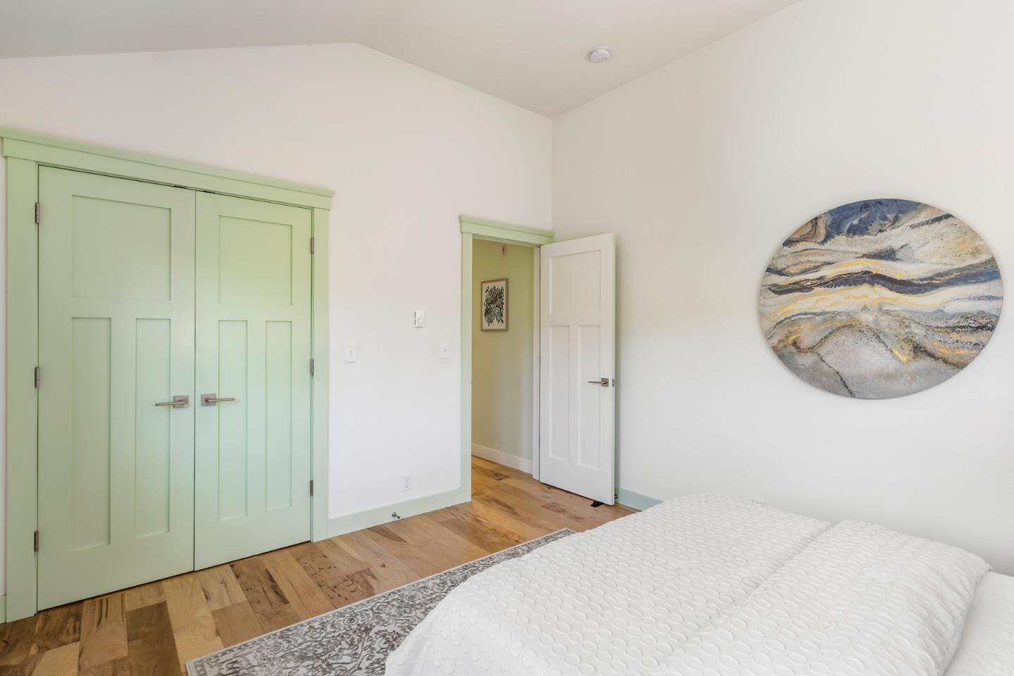 1975 Cordilleras Road Redwood City, CA 94062 - Photo 14 of 39 a bedroom with a bed and a mirror