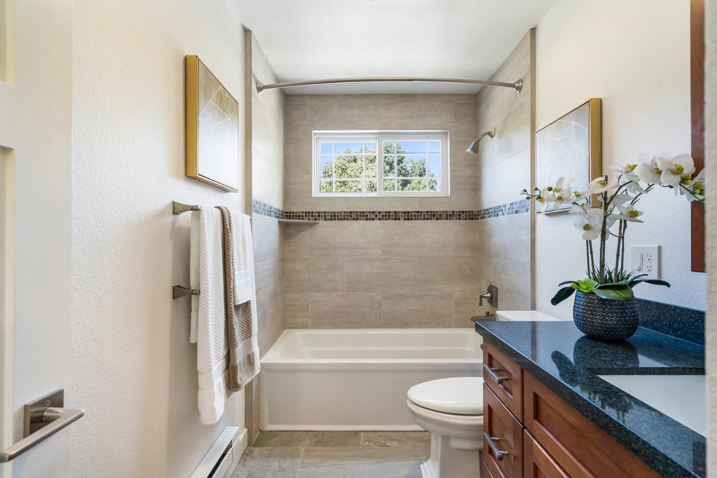 1975 Cordilleras Road Redwood City, CA 94062 - Photo 15 of 39 a bathroom with a sink a toilet and bathtub