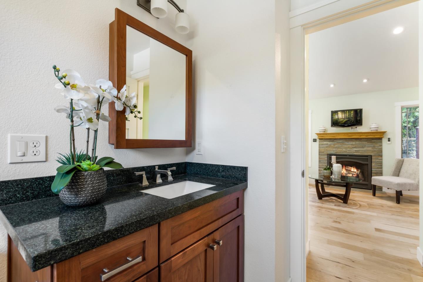 1975 Cordilleras Road Redwood City, CA 94062 - Photo 16 of 39 a bath room with a sink and a mirror