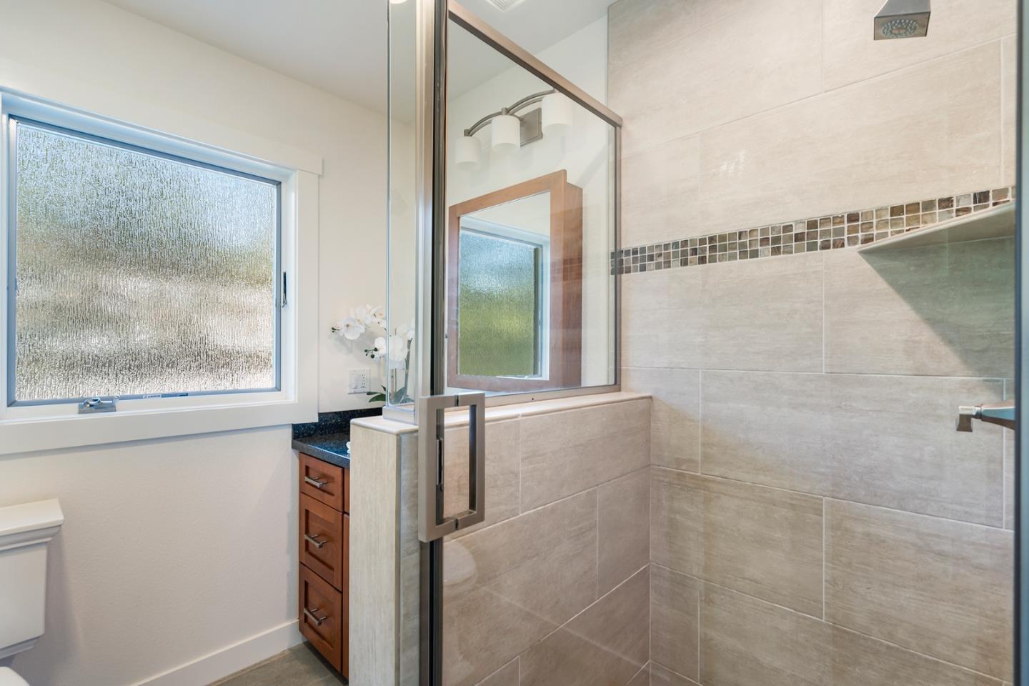 1975 Cordilleras Road Redwood City, CA 94062 - Photo 25 of 39 a bathroom with a shower and a window