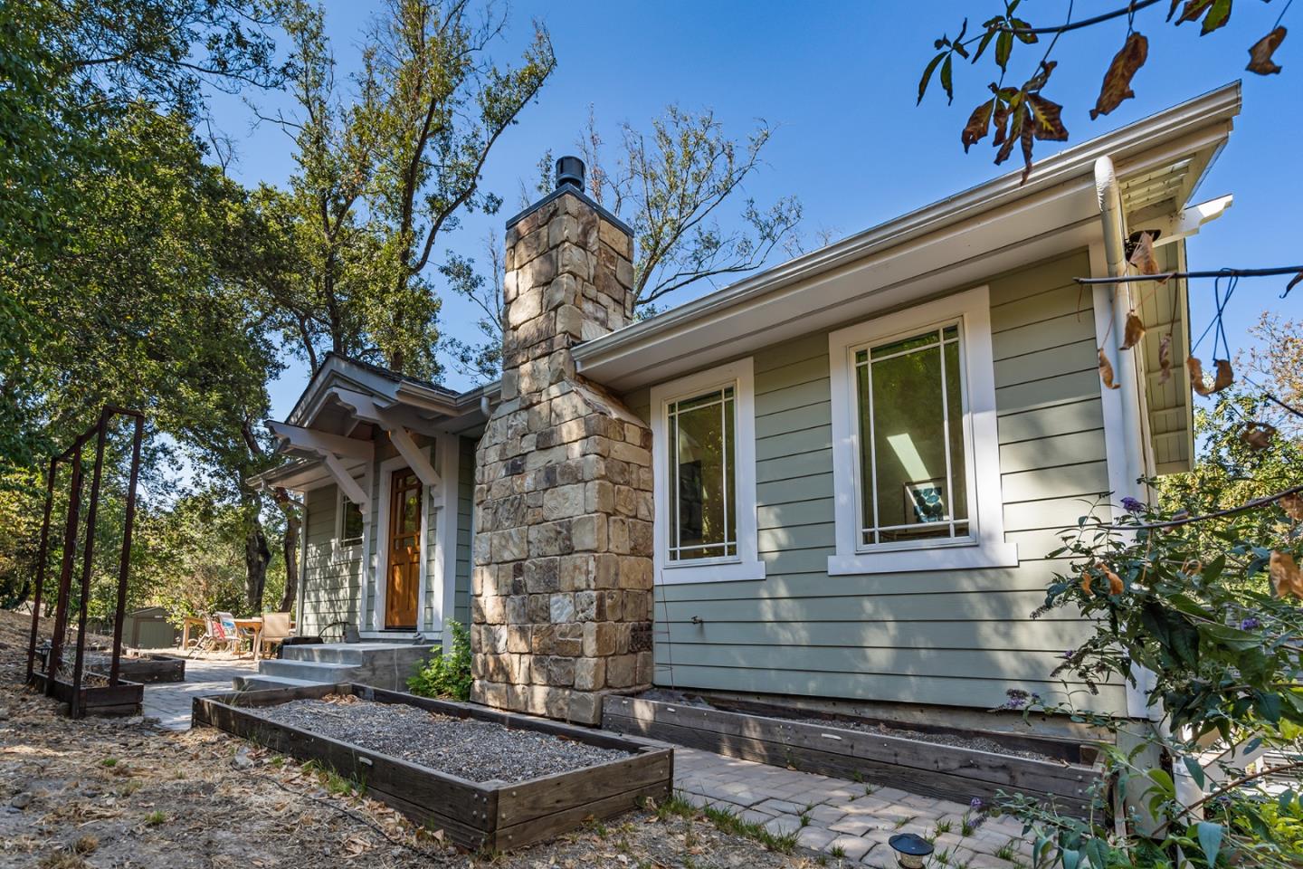 1975 Cordilleras Road Redwood City, CA 94062 - Photo 3 of 39 a front view of a house with garden