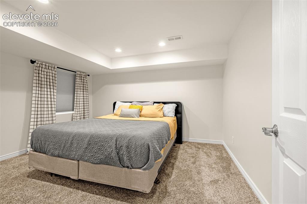 9127 Oakmont Road Peyton, CO 80831 - Photo 36 of 49 a bedroom with a bed and window
